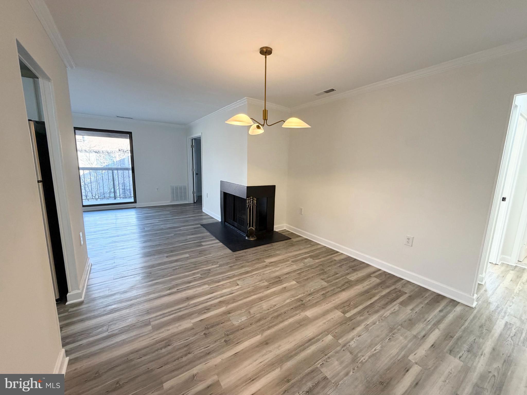 10024 Stedwick Road, Unit 301 Gaithersburg, MD 20886 - Photo 2 of 17 Spacious, modern living area with natural light.
