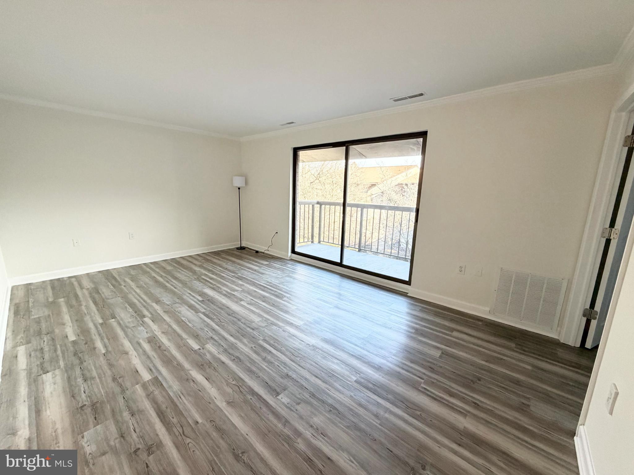 10024 Stedwick Road, Unit 301 Gaithersburg, MD 20886 - Photo 3 of 17 Spacious room with natural light and views.