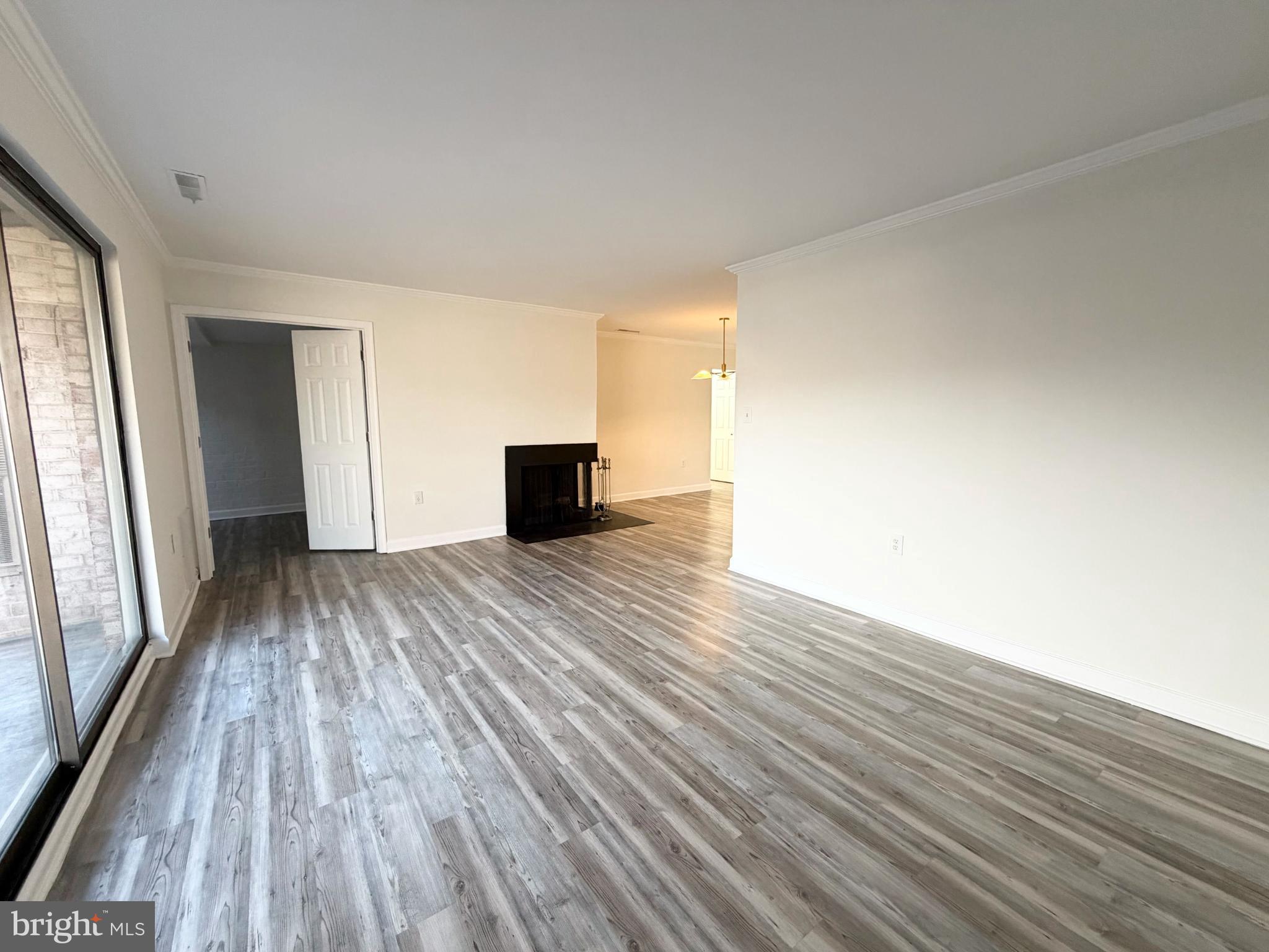 10024 Stedwick Road, Unit 301 Gaithersburg, MD 20886 - Photo 4 of 17 Spacious, light-filled living area awaits you.