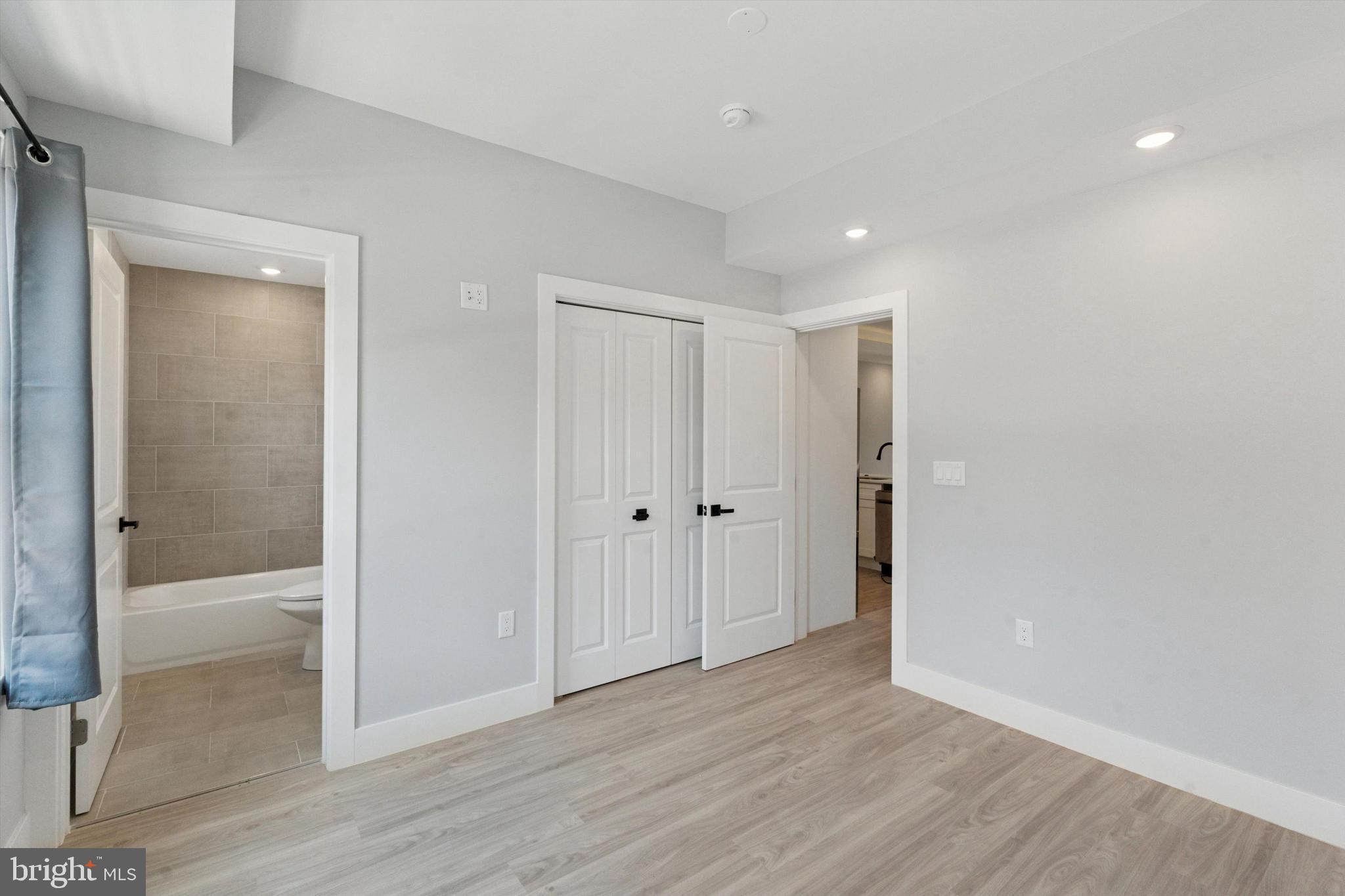 2401 North 2nd Street, Unit E1 Philadelphia, PA 19133 - Photo 4 of 12 a view of a hallway with wooden floor