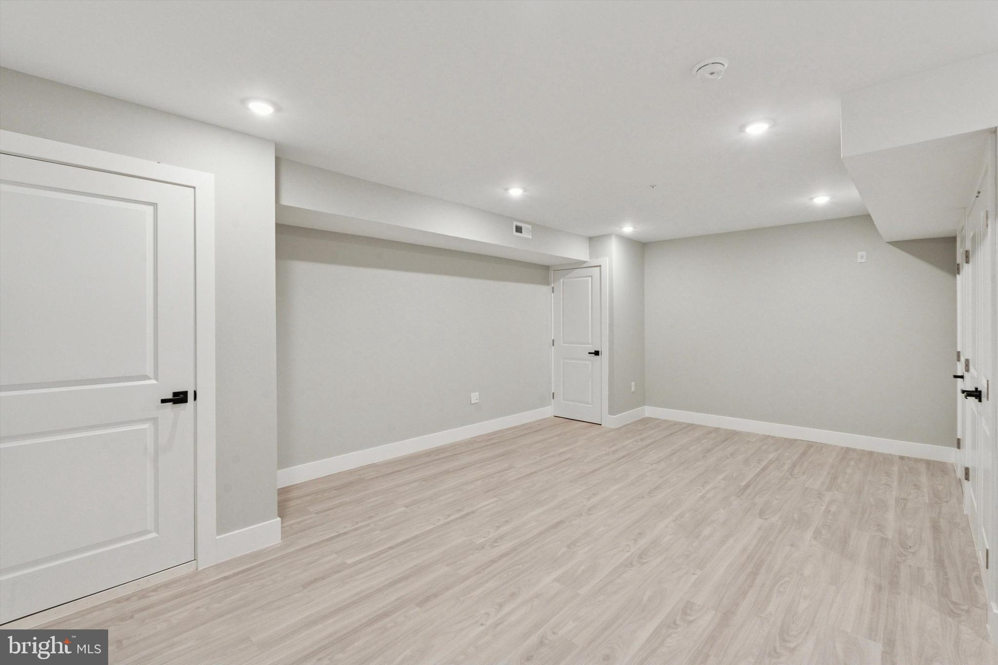 2401 North 2nd Street, Unit E1 Philadelphia, PA 19133 - Photo 7 of 12 a view of an empty room with wooden floor