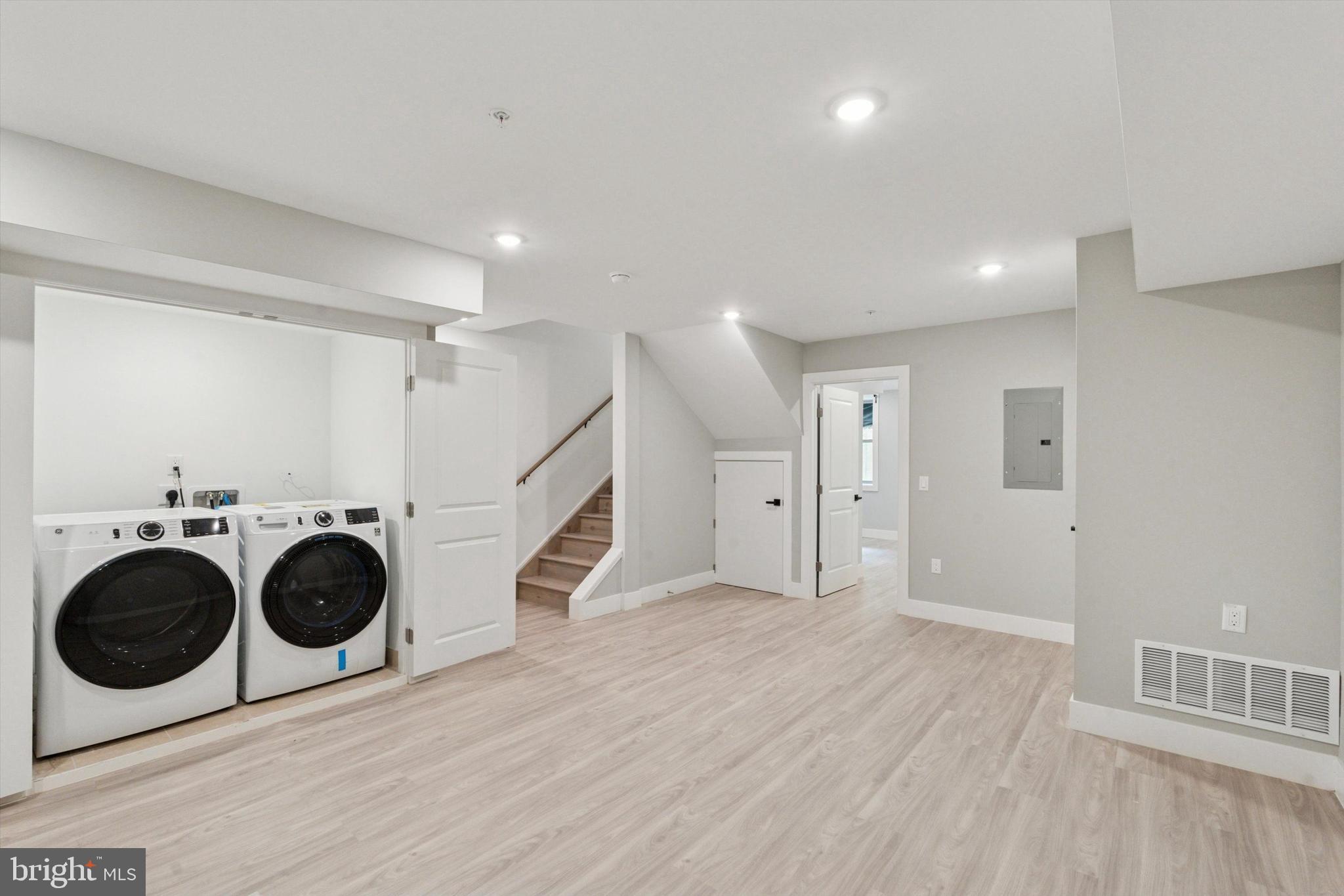 2401 North 2nd Street, Unit E1 Philadelphia, PA 19133 - Photo 9 of 12 a view of a hallway with washer and dryer