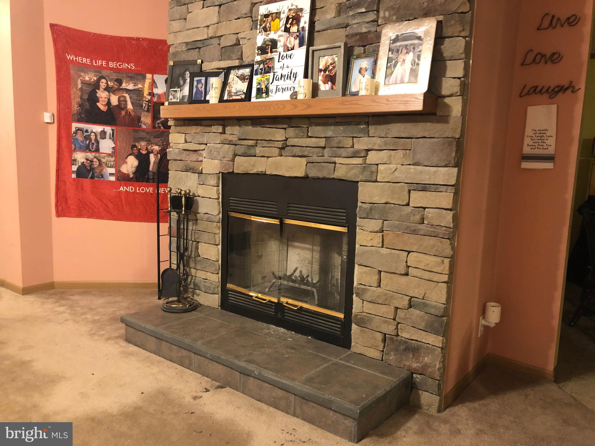 5035 Sands Road Lothian, MD 20711 - Photo 5 of 25 Wood Burning Fireplace in Living Room