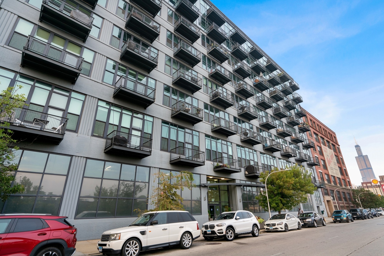 a view of cars parked in front of a building