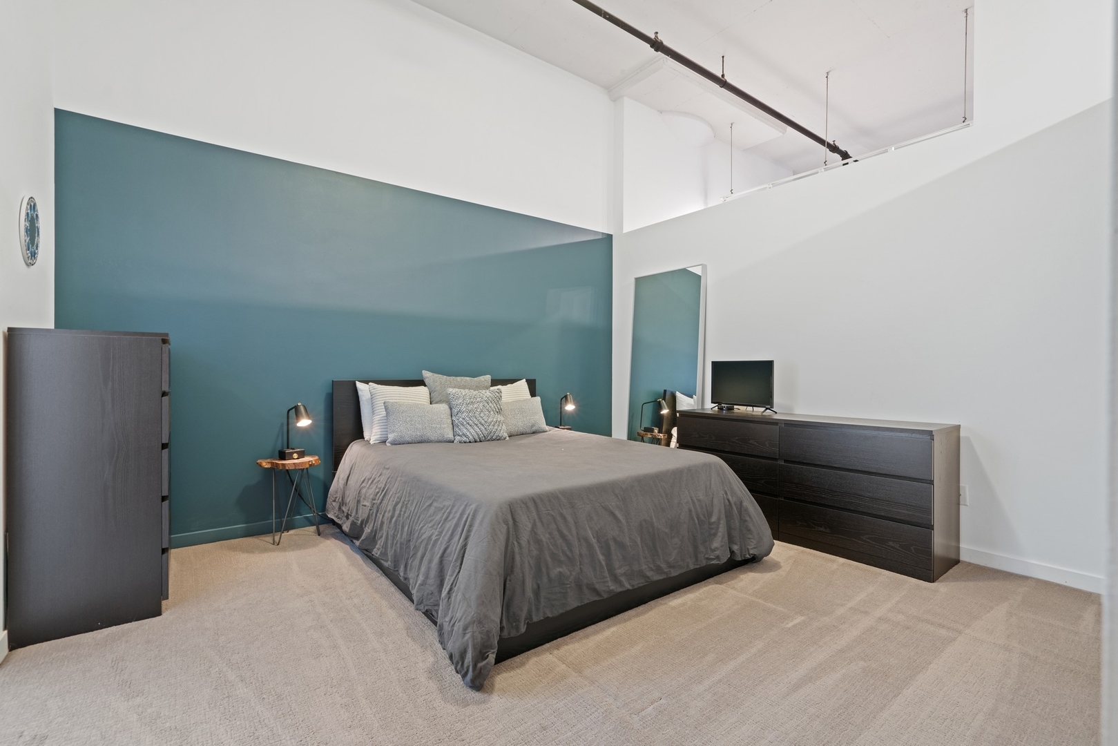 1224 West Van Buren Street, Unit 304 Chicago, IL 60607 - Photo 16 of 28 a bedroom with a bed and a closet