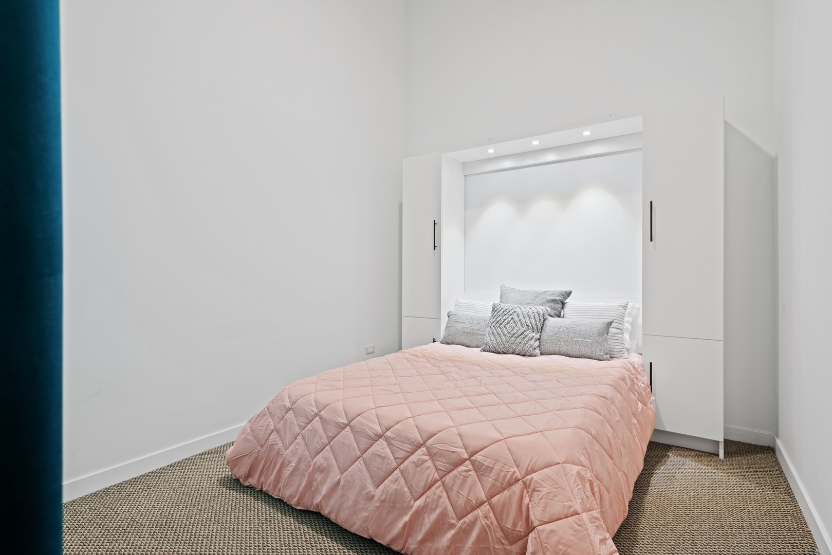 1224 West Van Buren Street, Unit 304 Chicago, IL 60607 - Photo 21 of 28 a bedroom with a bed and a mirror