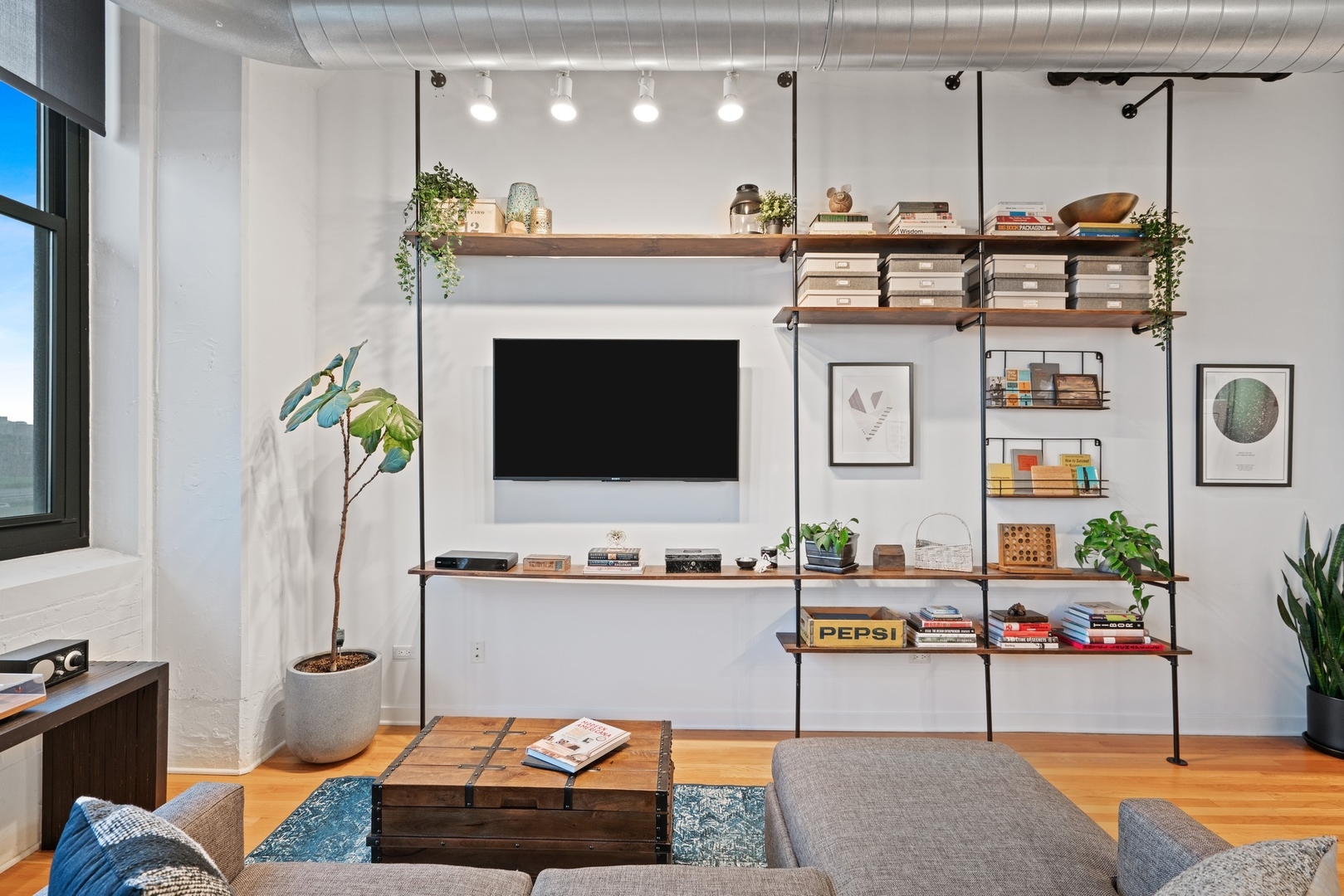 1224 West Van Buren Street, Unit 304 Chicago, IL 60607 - Photo 7 of 28 a living room with furniture and a fireplace