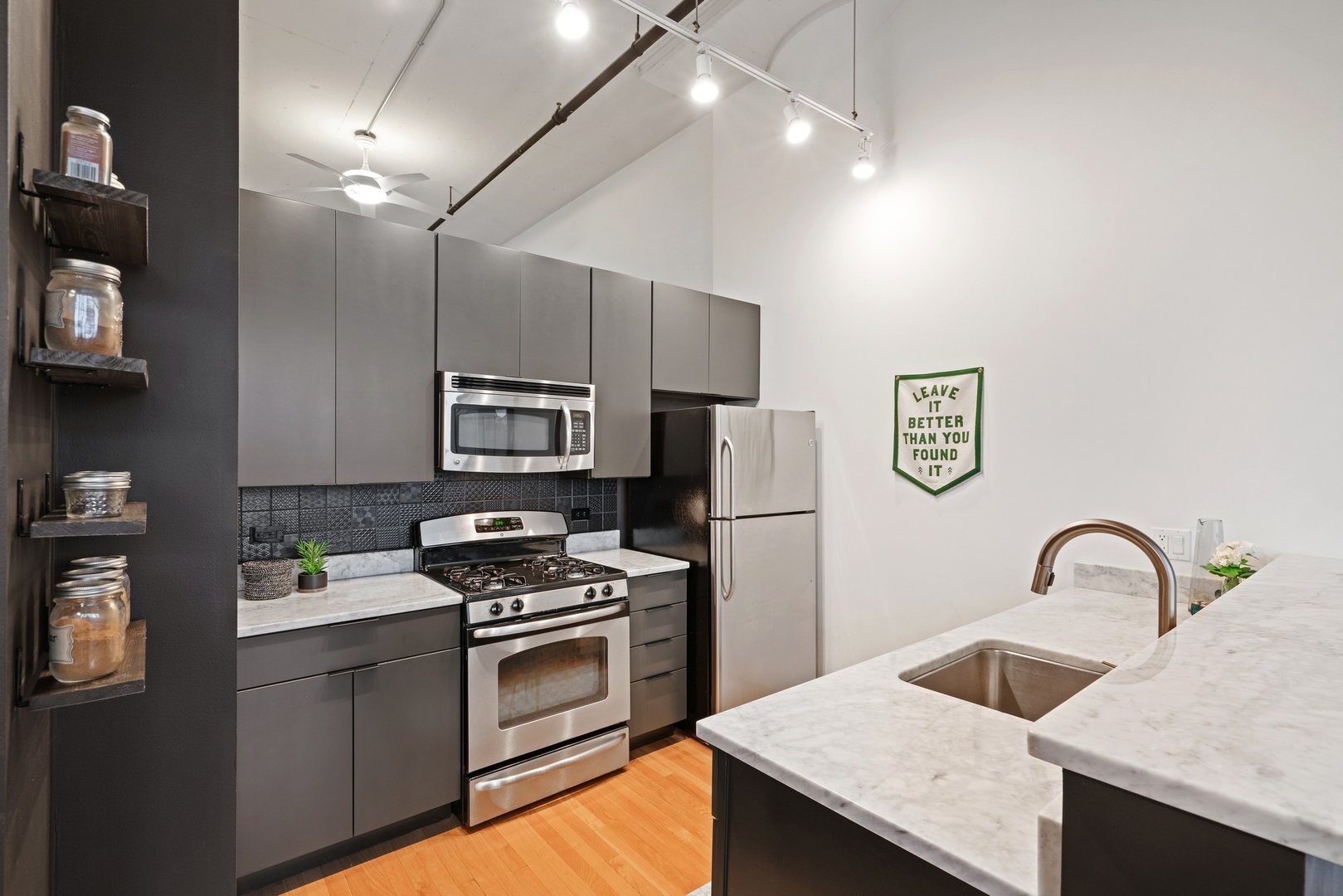 1224 West Van Buren Street, Unit 304 Chicago, IL 60607 - Photo 10 of 28 a kitchen with appliances a sink and cabinets