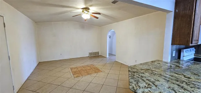 a view of a livingroom with a kitchen