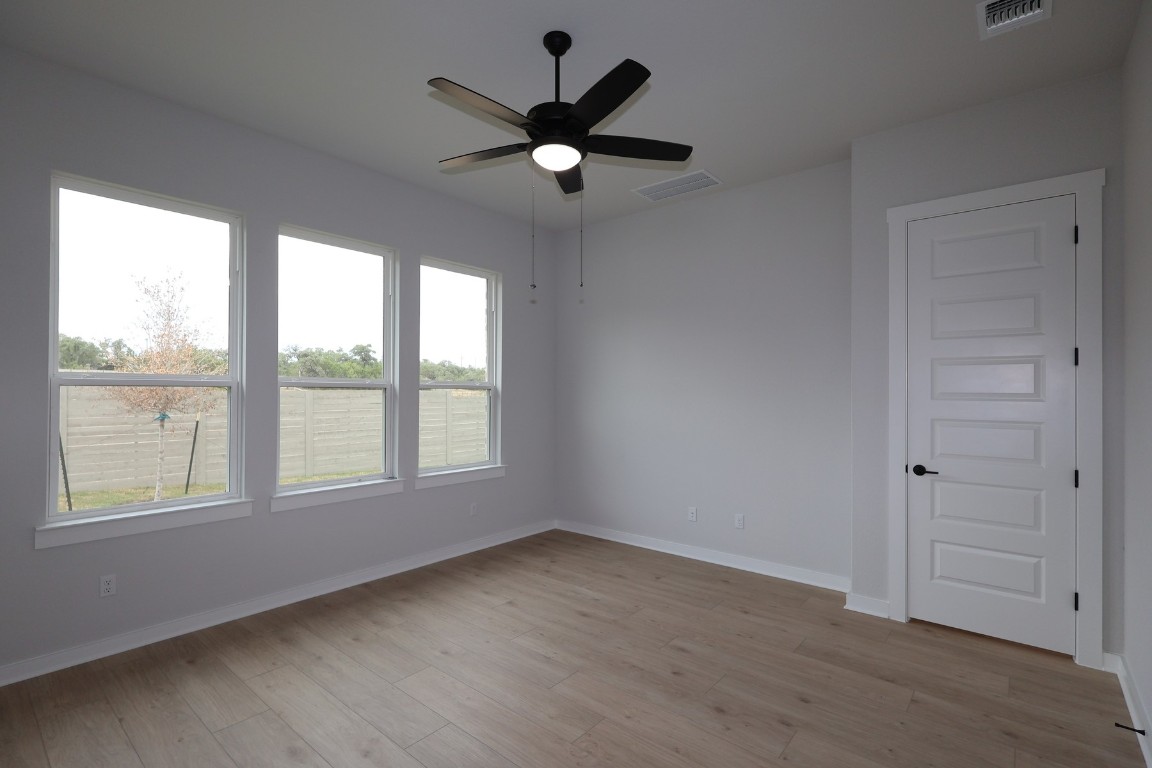 421 Leaning Rock Road Georgetown, TX 78628 - Photo 7 of 14 a view of an empty room with a window