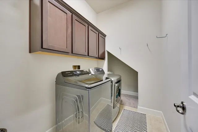 a utility room with a sink a washer and dryer