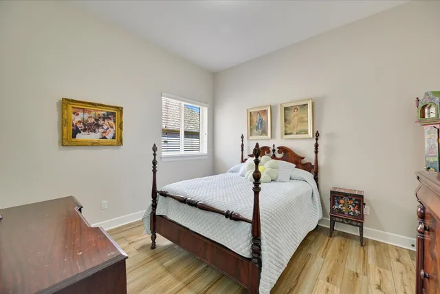 a bed room with a bed and a window