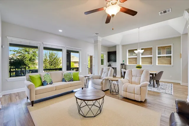 a living room with furniture and a large window