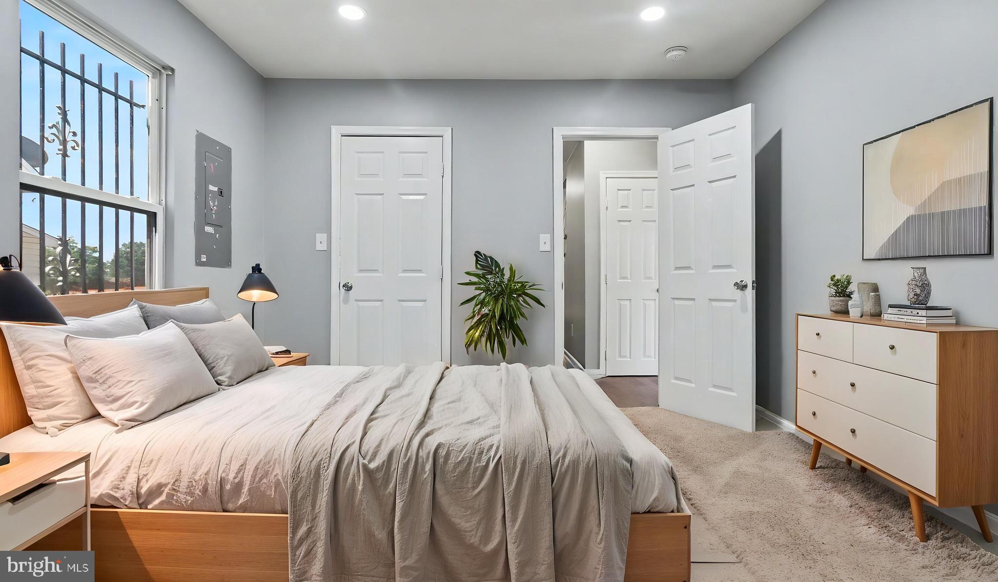 4203 Shell Street Capitol Heights, MD 20743 - Photo 26 of 47 a bedroom with a bed and a potted plant