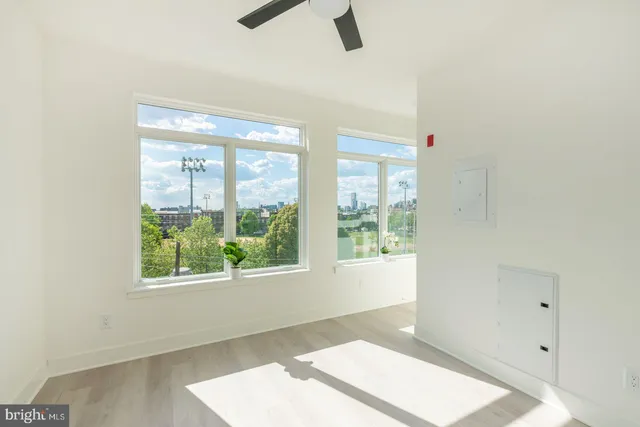 a kitchen with stainless steel appliances kitchen island granite countertop a refrigerator and a sink