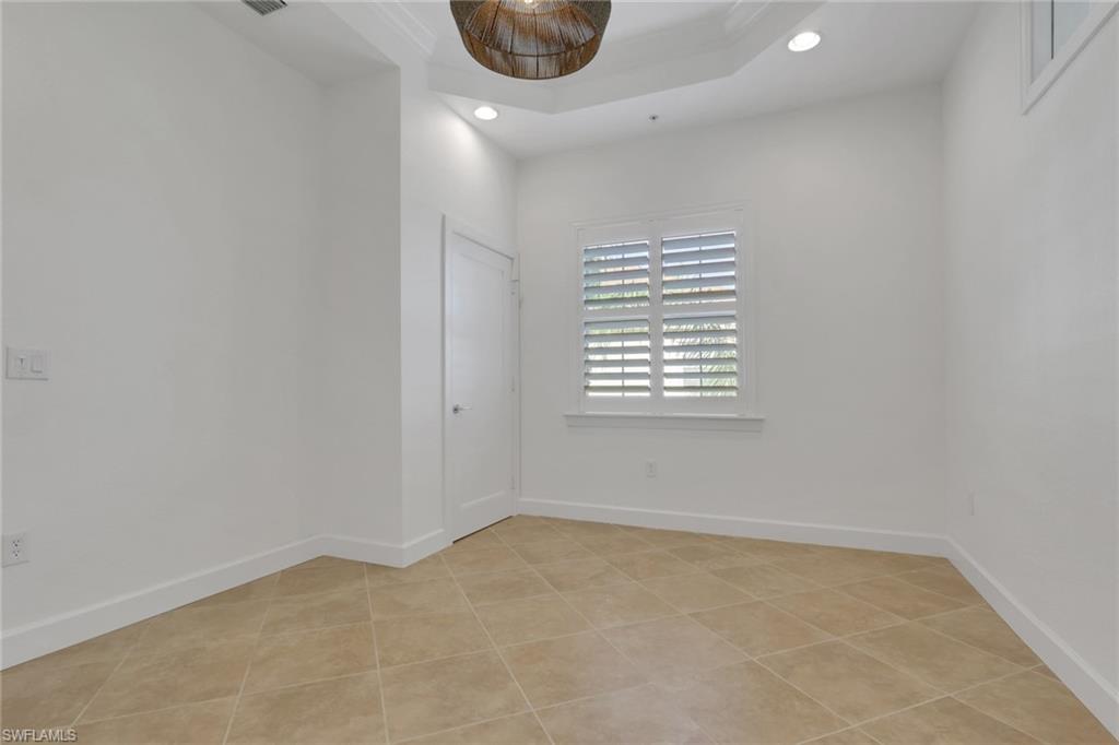 7877 Clemson Street, Unit 202 Naples, FL 34104 - Photo 23 of 36 an empty room with a window