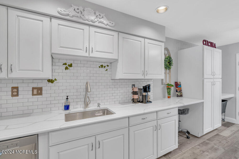 2 Bramble Lane Matawan, NJ 07747 - Photo 14 of 28 a kitchen with white cabinets and a sink