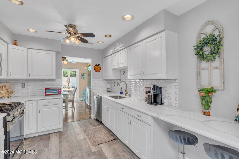 2 Bramble Lane Matawan, NJ 07747 - Photo 15 of 28 a kitchen with a white cabinets and window