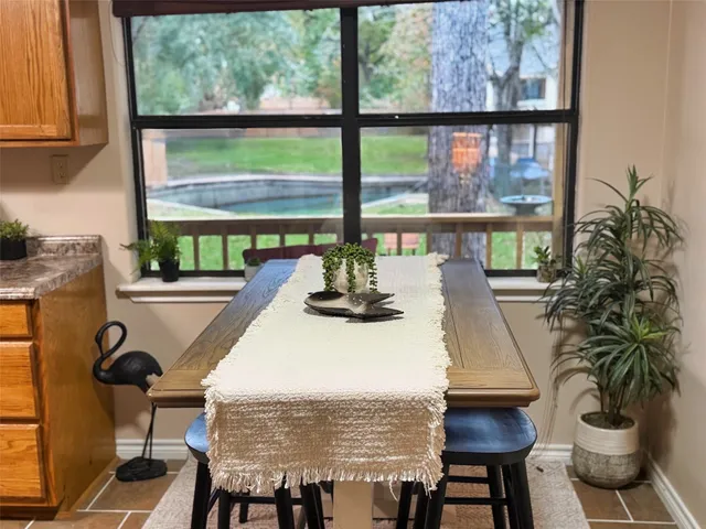 a view of a dining room with furniture window and outside view