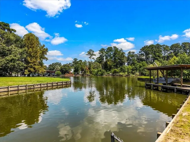 a view of a lake with a house in the background
