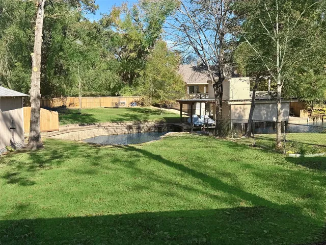 a view of a park with large trees