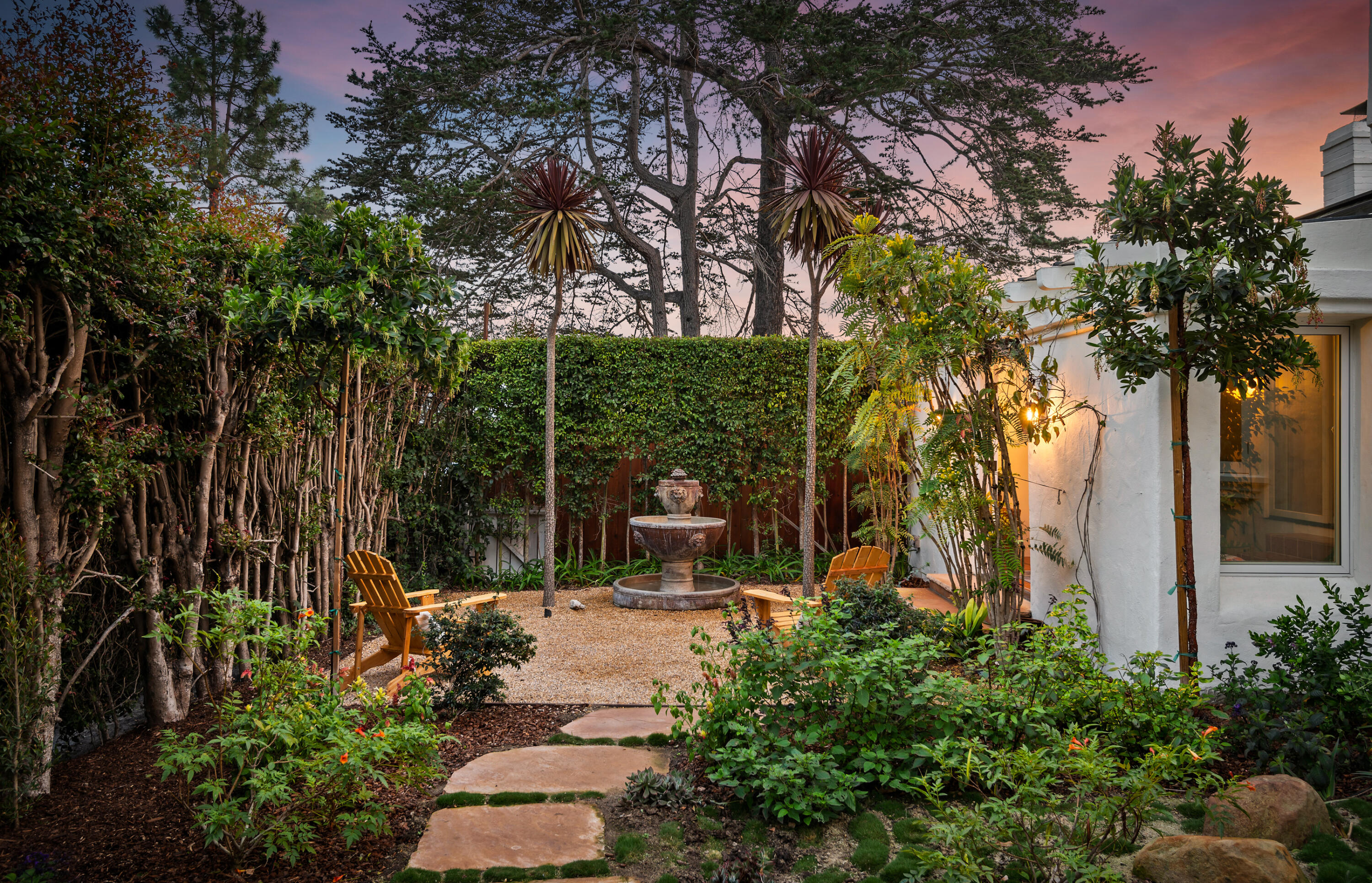 189 Hermosillo Road Montecito, CA 93108 - Photo 6 of 47 a view of a patio with table and chairs potted plants and large tree