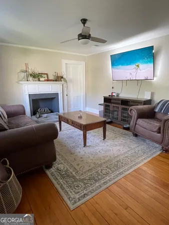 a view of a livingroom with furniture and a fireplace