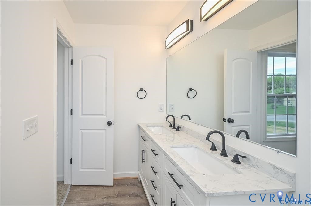 815 Kirby Street West Point, VA 23181 - Photo 21 of 29 a bathroom with double sink and a mirror