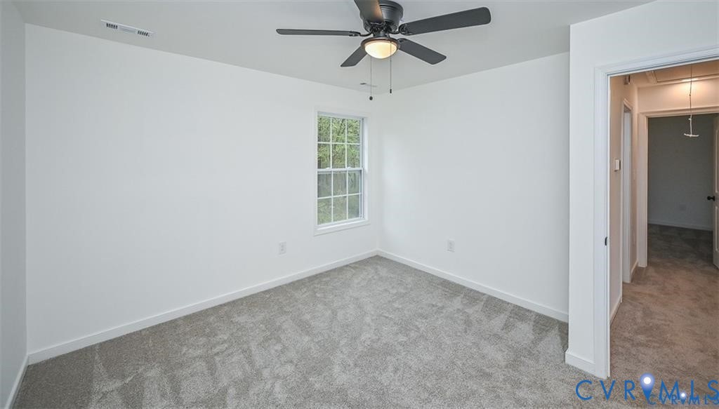 815 Kirby Street West Point, VA 23181 - Photo 23 of 29 an empty room with fan and windows