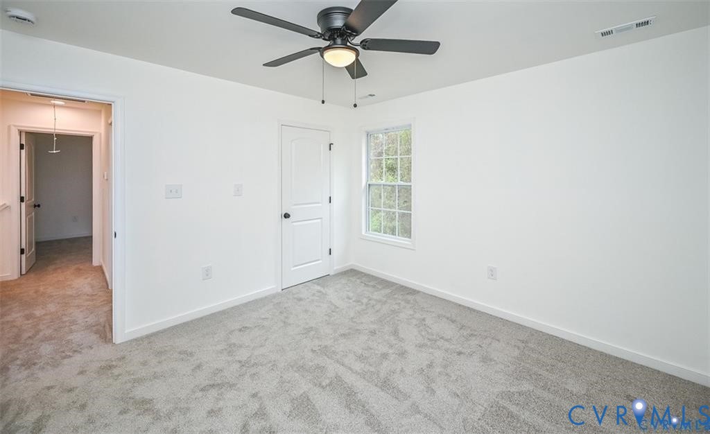 815 Kirby Street West Point, VA 23181 - Photo 26 of 29 an empty room with closet and windows