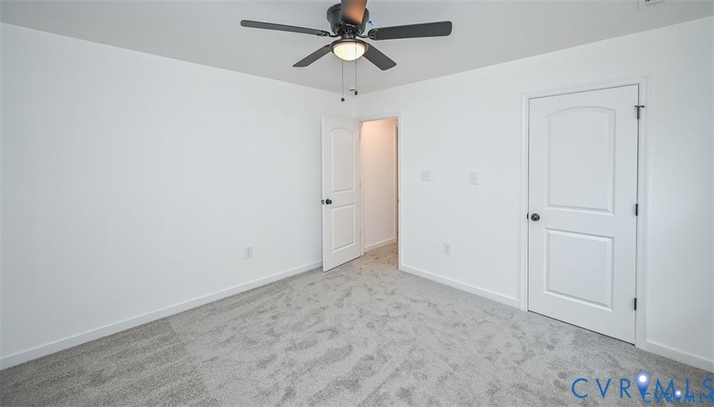 815 Kirby Street West Point, VA 23181 - Photo 27 of 29 an empty room with chandelier fan