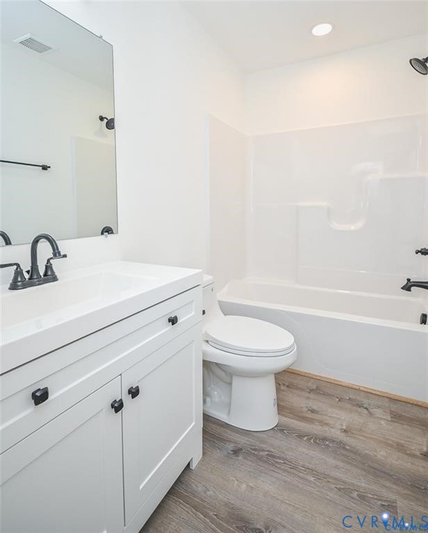 815 Kirby Street West Point, VA 23181 - Photo 28 of 29 a bathroom with a white toilet sitting next to a bathroom sink and a shower