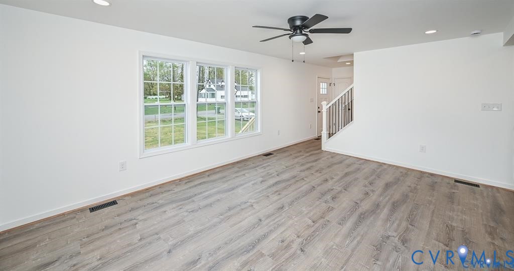 815 Kirby Street West Point, VA 23181 - Photo 3 of 29 wooden floor in an empty room with a window