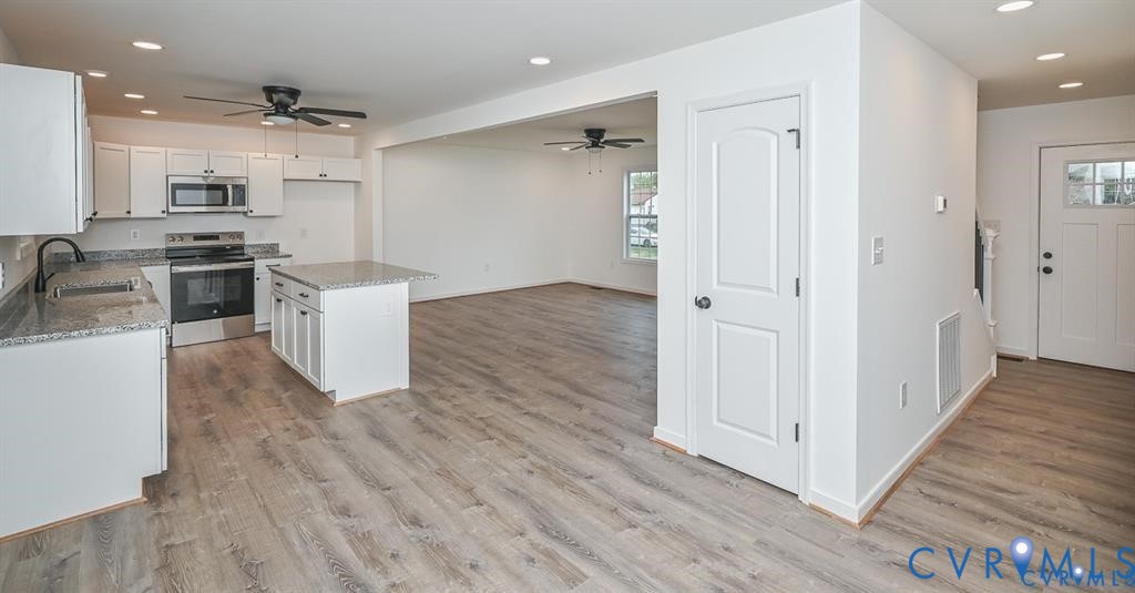 815 Kirby Street West Point, VA 23181 - Photo 9 of 29 a view of kitchen with wooden floor
