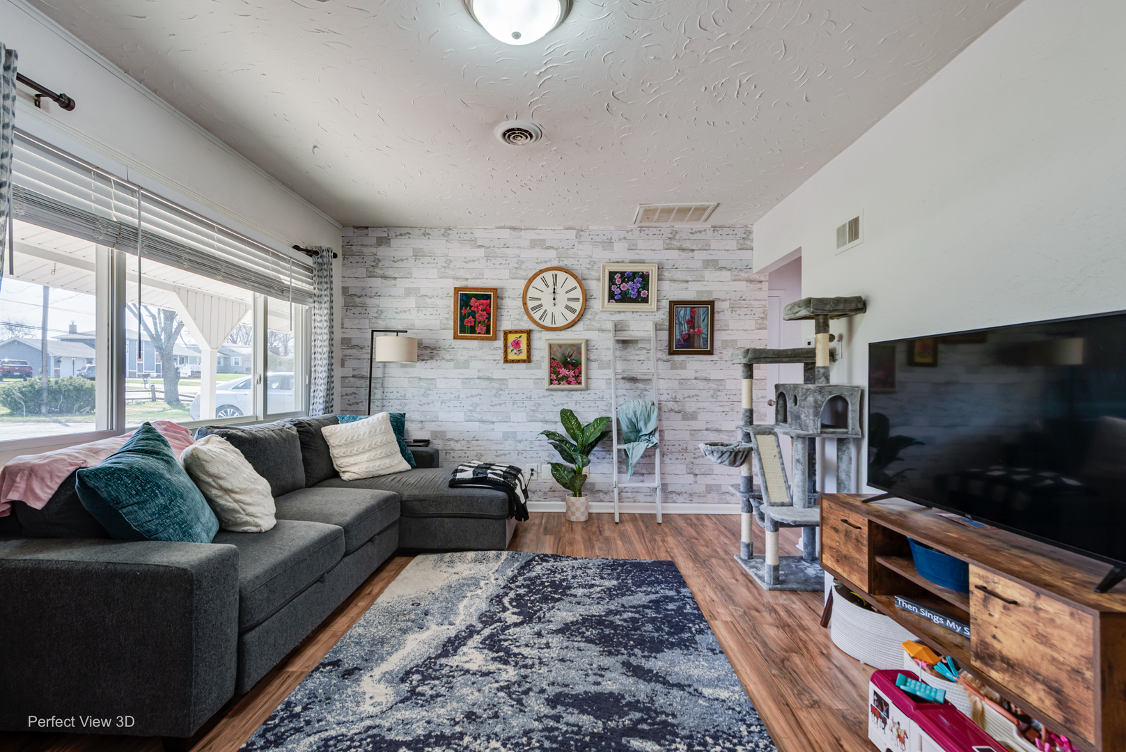 11248 193rd Street Mokena, IL 60448 - Photo 2 of 20 a living room with furniture and a flat screen tv