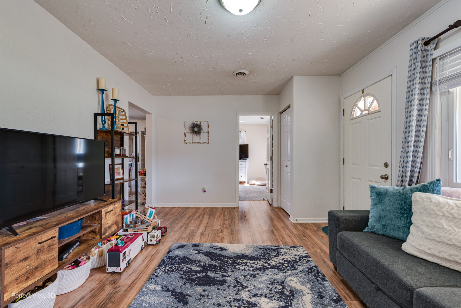 11248 193rd Street Mokena, IL 60448 - Photo 3 of 20 a living room with furniture and a flat screen tv