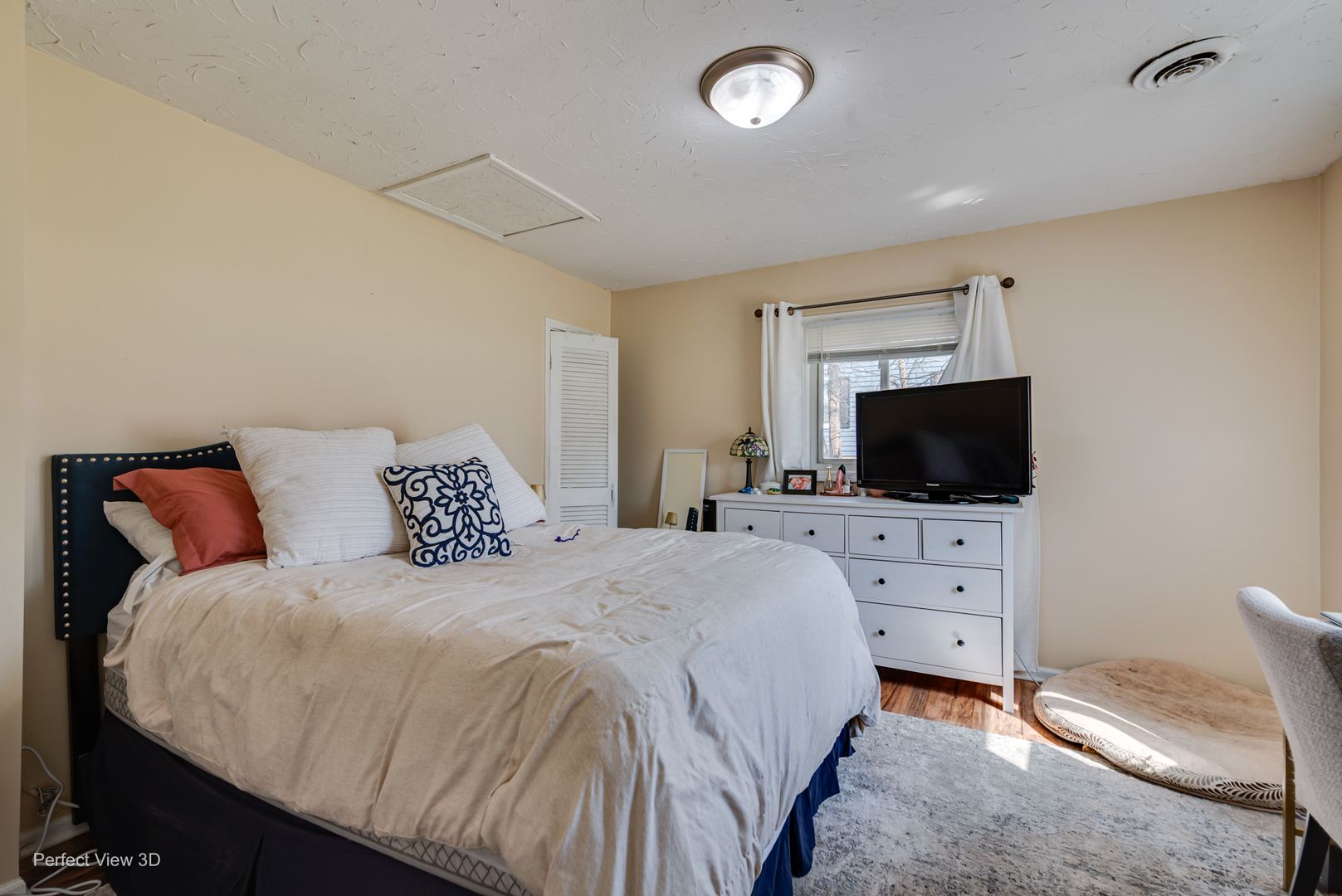 11248 193rd Street Mokena, IL 60448 - Photo 5 of 20 a bedroom with a bed and a flat screen tv