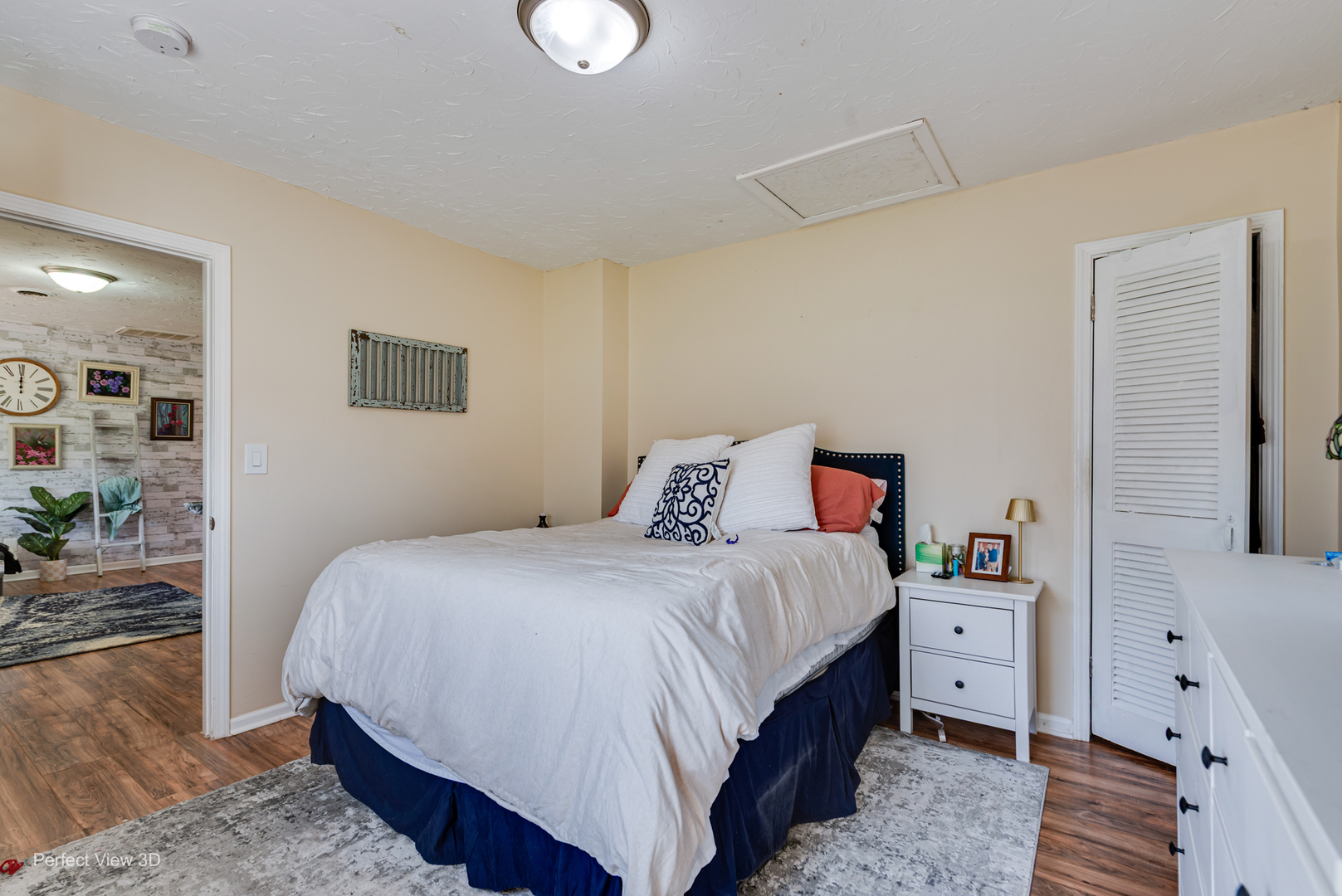 11248 193rd Street Mokena, IL 60448 - Photo 6 of 20 a bedroom with a bed and a flat tv screen on dresser