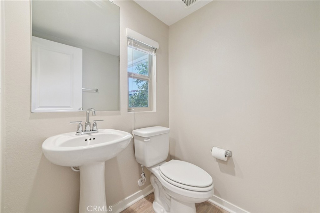 143 Frame Irvine, CA 92618 - Photo 23 of 41 a bathroom with a sink a toilet and mirror