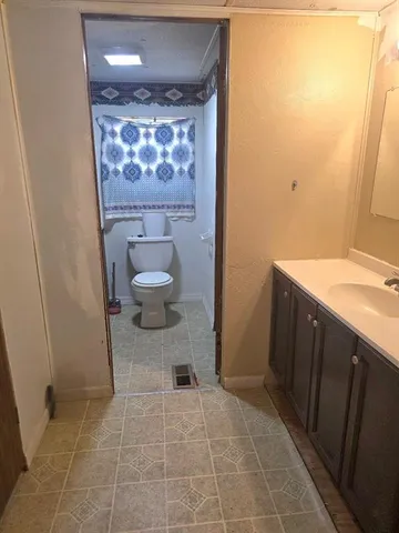 a bathroom with a sink and a toilet
