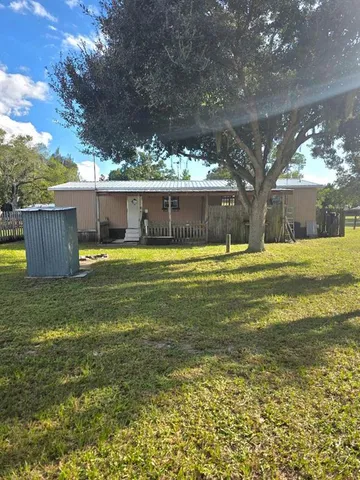 a view of a swimming pool with an outdoor space and seating area