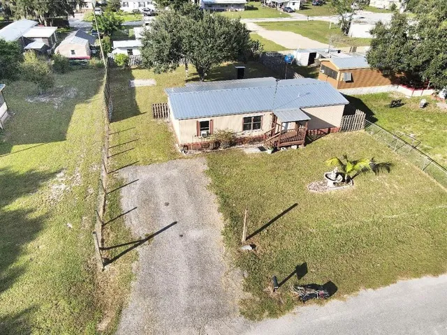 an aerial view of a house with a ocean view
