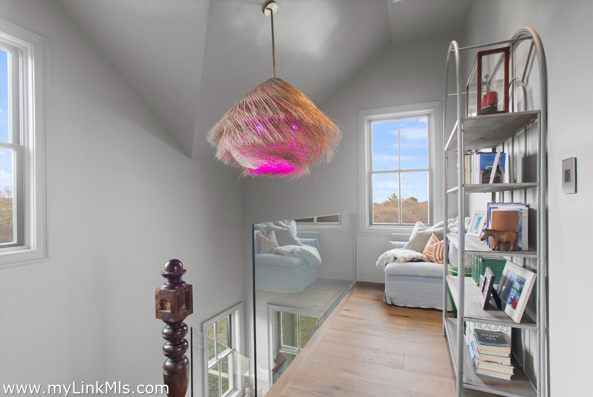 13 Parson Lane Nantucket, MA 02554 - Photo 12 of 44 a bedroom with furniture and a chandelier