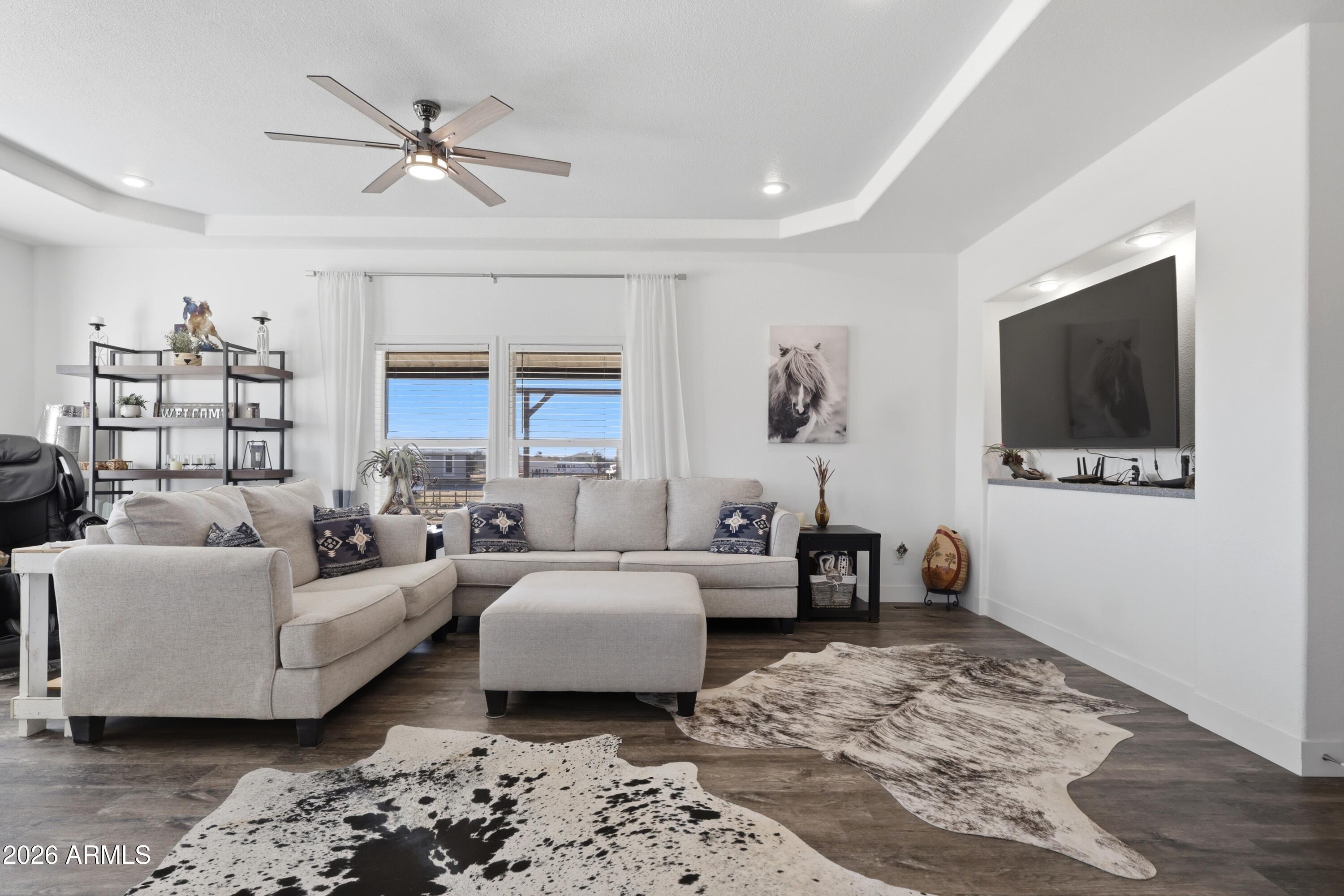 22454 West Steel Horse Road Congress, AZ 85332 - Photo 13 of 44 a living room with furniture and a flat screen tv