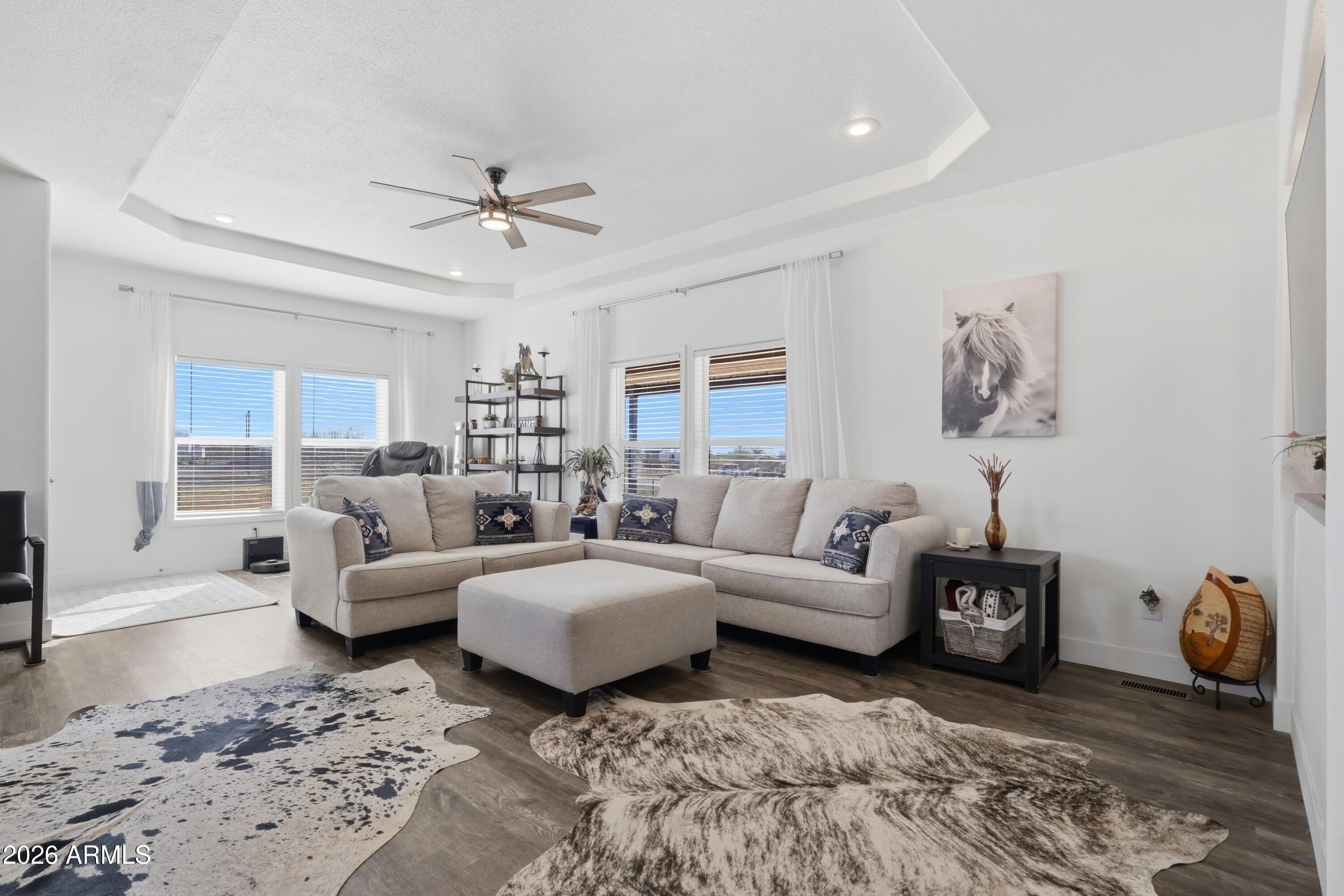 22454 West Steel Horse Road Congress, AZ 85332 - Photo 14 of 44 a living room with furniture and a chandelier