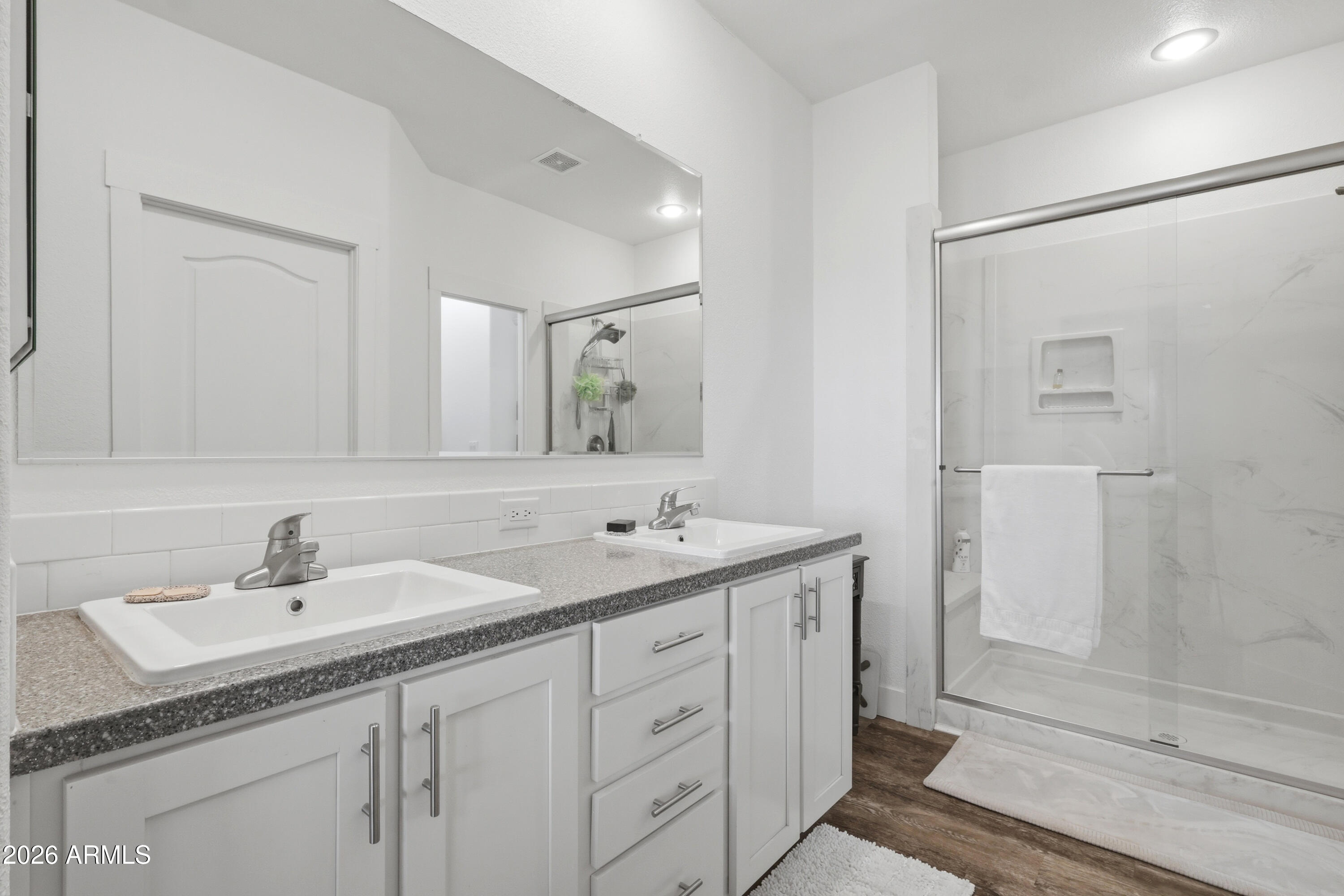 22454 West Steel Horse Road Congress, AZ 85332 - Photo 21 of 44 a bathroom with a double vanity sink and mirror