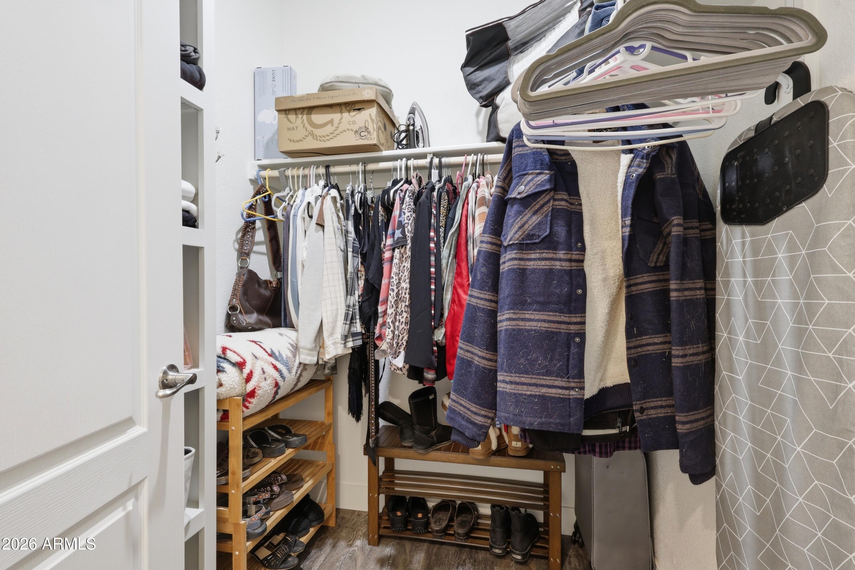22454 West Steel Horse Road Congress, AZ 85332 - Photo 23 of 44 a view of walk in closet with clothes and shoes