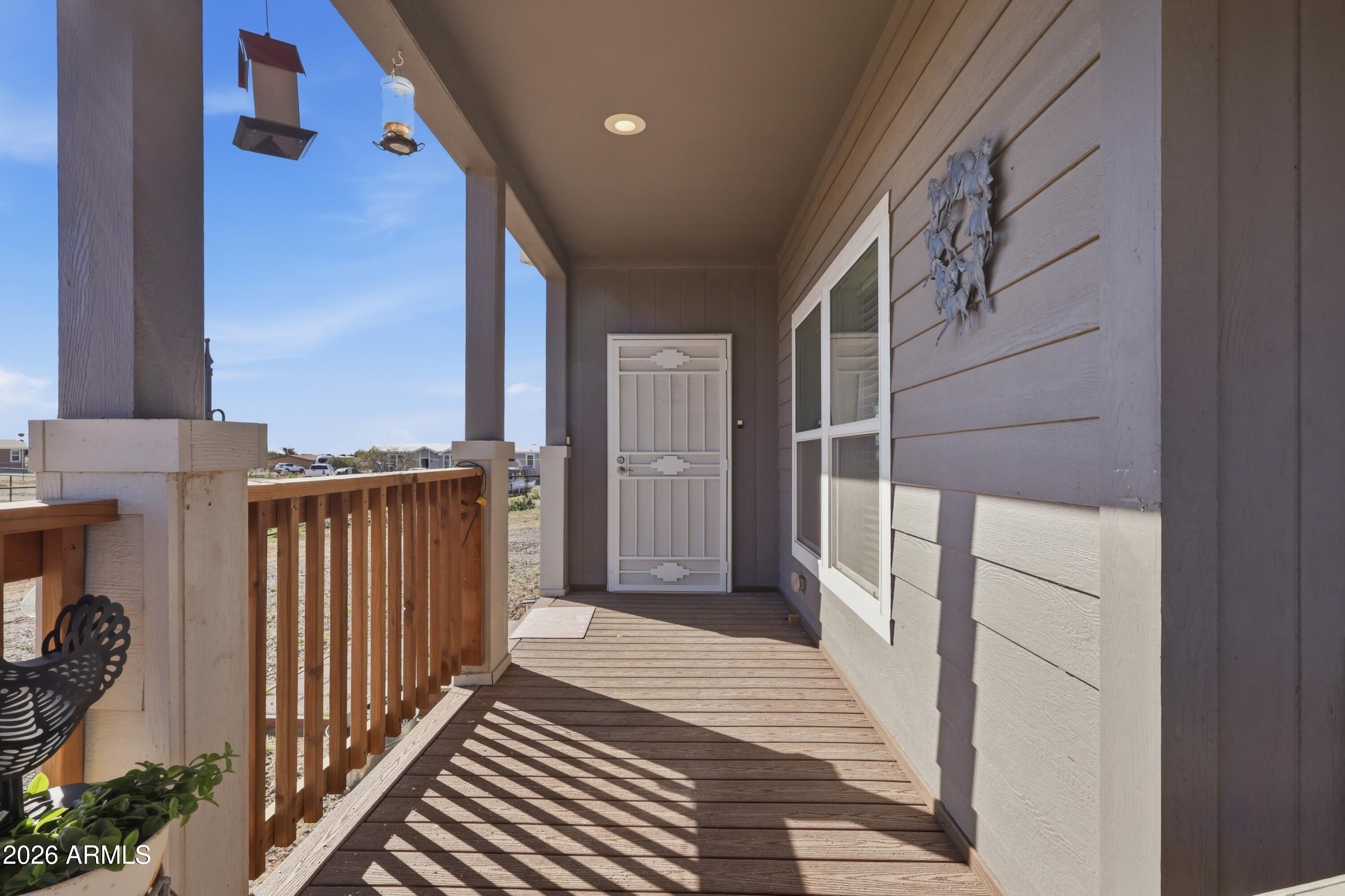 22454 West Steel Horse Road Congress, AZ 85332 - Photo 41 of 44 a view of a house with a door and wooden floor