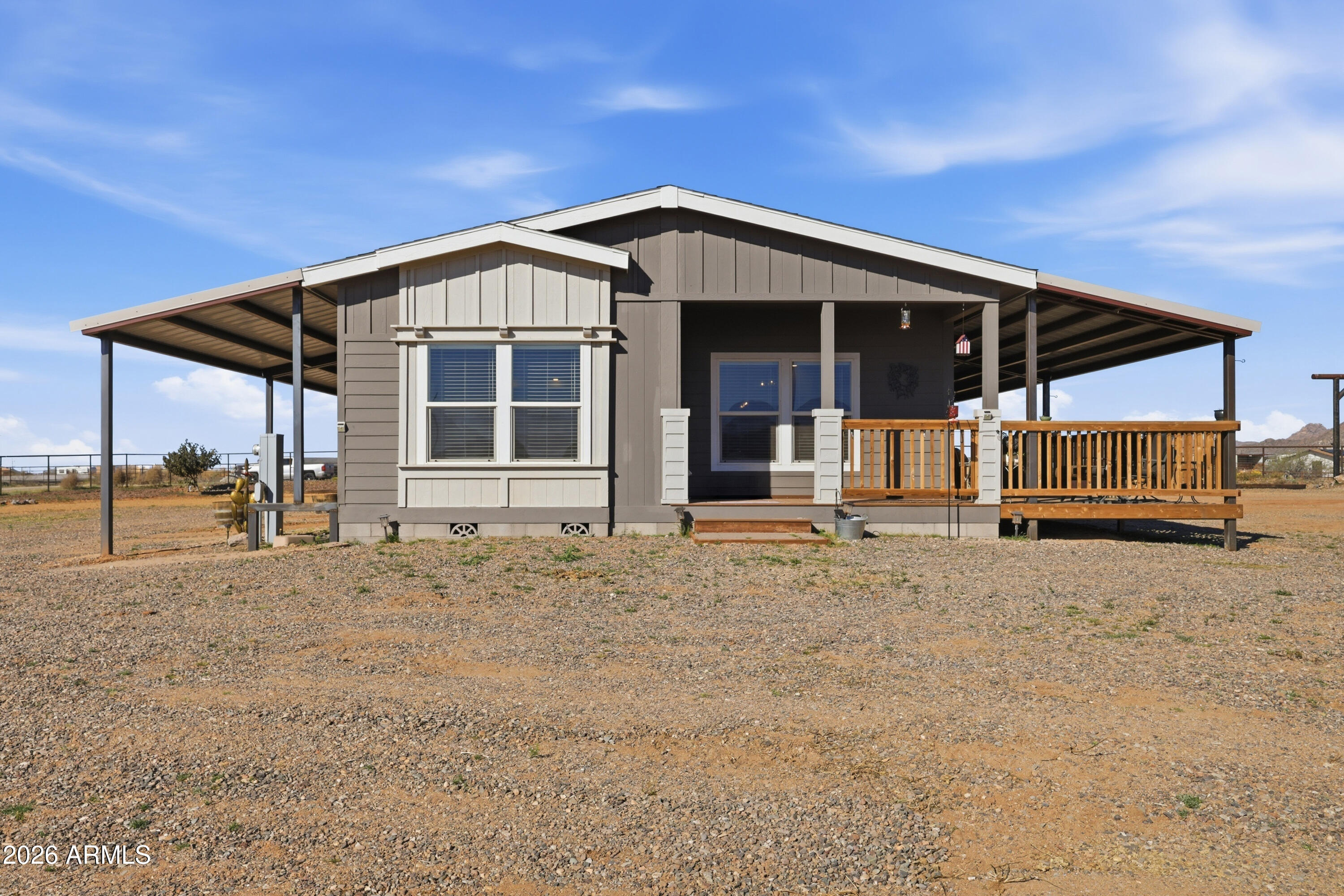 22454 West Steel Horse Road Congress, AZ 85332 - Photo 42 of 44 a front view of a house with a yard