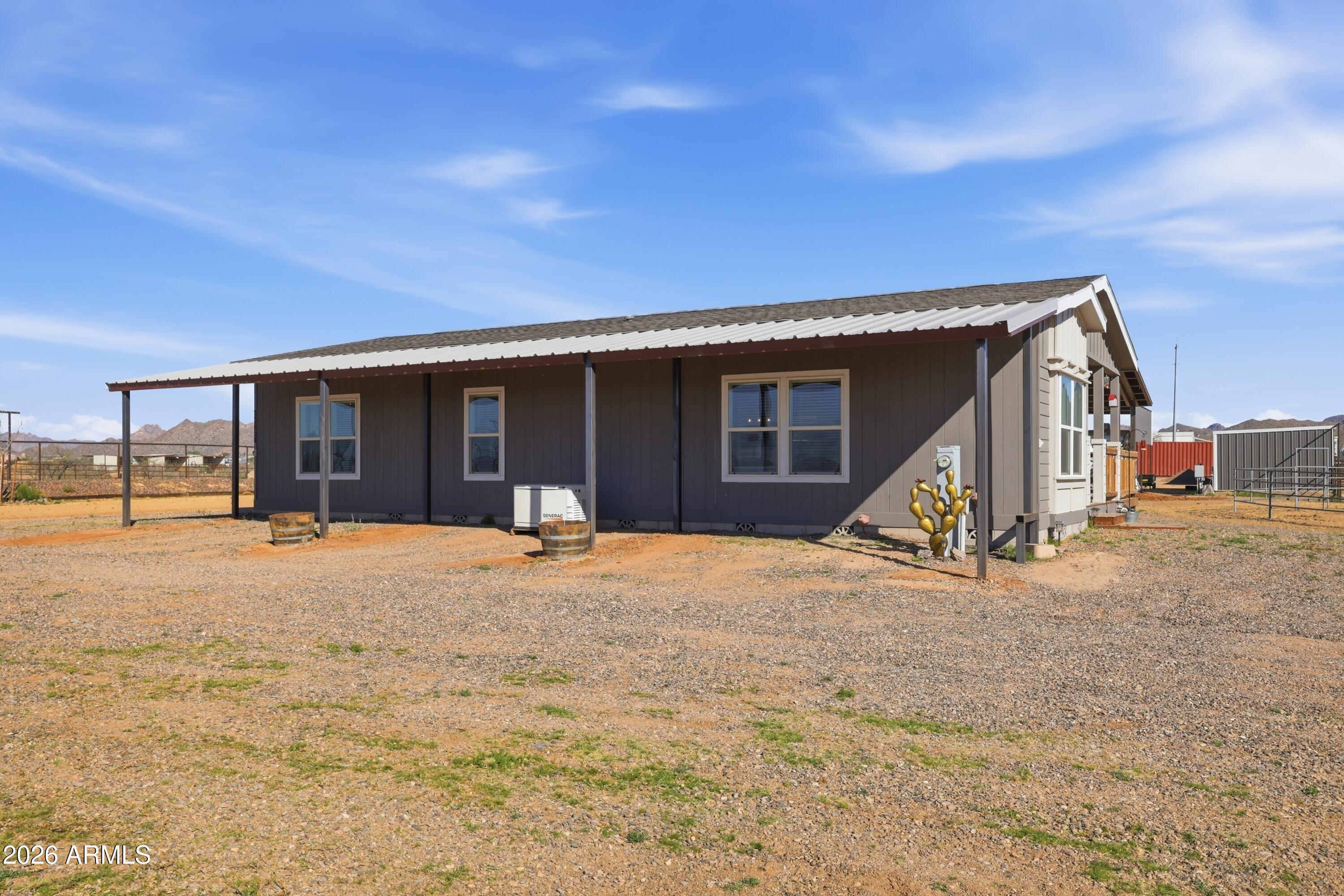 22454 West Steel Horse Road Congress, AZ 85332 - Photo 43 of 44 a view of a house with backyard and porch